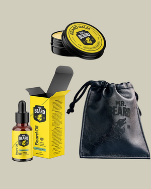 A grooming bundle for beard care including a bottle of beard oil, a container of beard balm, a leather travel pouch, and a yellow box with a beard oil refill inside.
