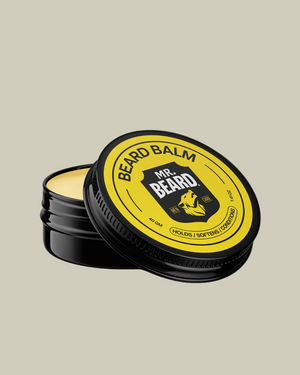 Mr. Beard beard balm container with yellow label on a black background