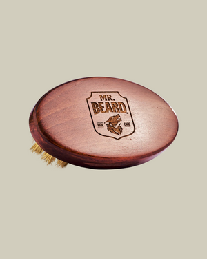 Wooden beard brush with 'MR. BEARD' logo on a white background