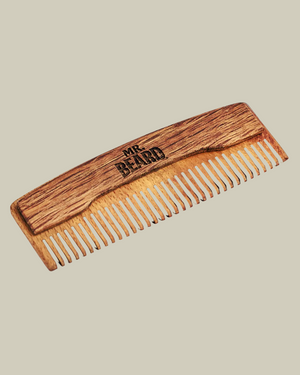 Wooden comb with 'MR BEARD' branding on a black background