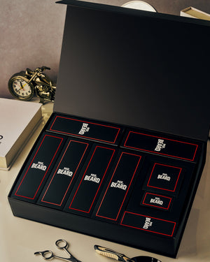 Set of 'Mr. Beard' grooming products in a black box with grooming tools on a table.