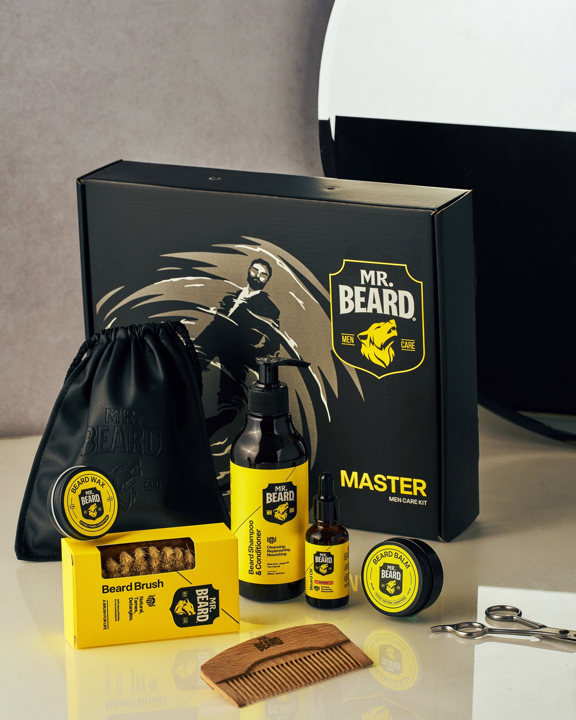 Mr. Beard grooming kit with various products on a reflective surface.