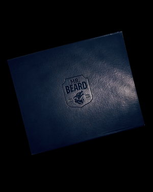 Dark blue leather-bound book with 'MR. BEARD' embossed logo on a black background