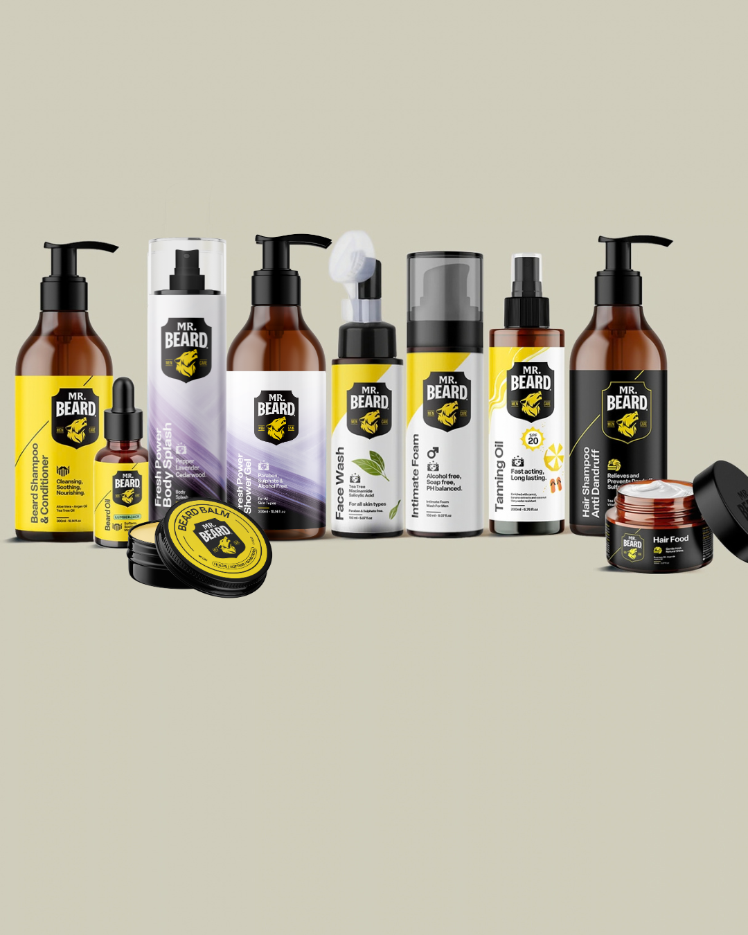 A lineup of beard care products from The Beard Brand, including beard oil, beard balm, beard wash, and beard treatment, arranged on a solid light beige background.