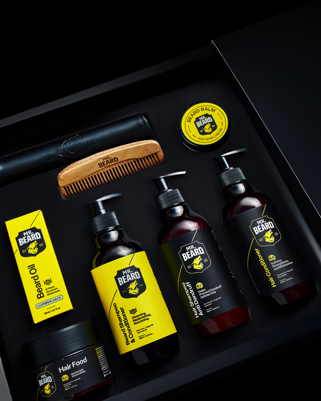 Collection of Mr. Beard grooming products on a dark background