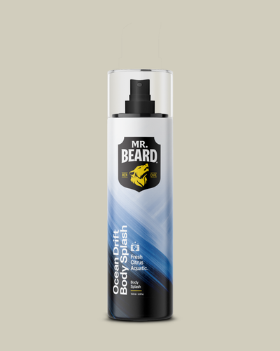 A bottle of Mr. Beard Ocean Breeze Body Splash fresh citrus aquatic spray, featuring a white and blue gradient design with a black pump dispenser, set against a solid beige background.