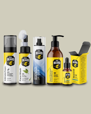 A lineup of Mr. Beard grooming products on a solid beige background, including a beard balm bottle, face wash, beard oil, conditioner, and foam bottles, alongside their yellow and black packaging.